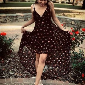 Black high low dress with a rose print